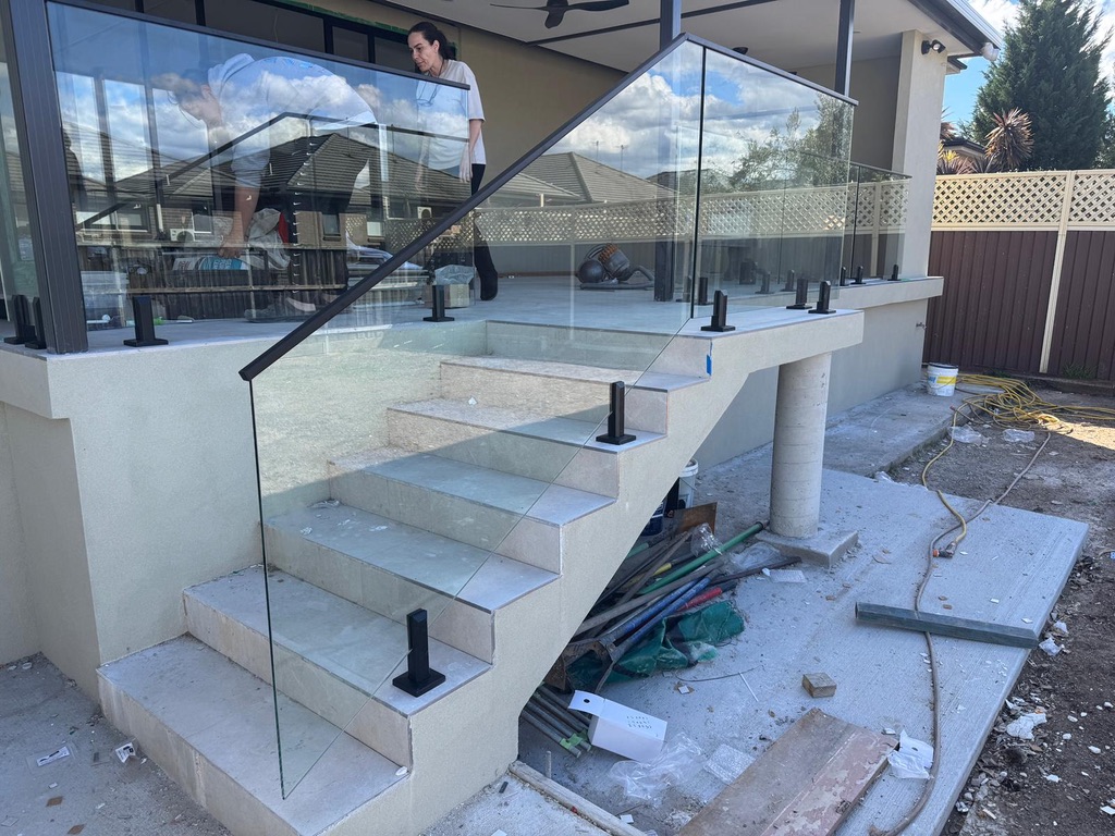 Outdoor stair glass balustrade with black posts